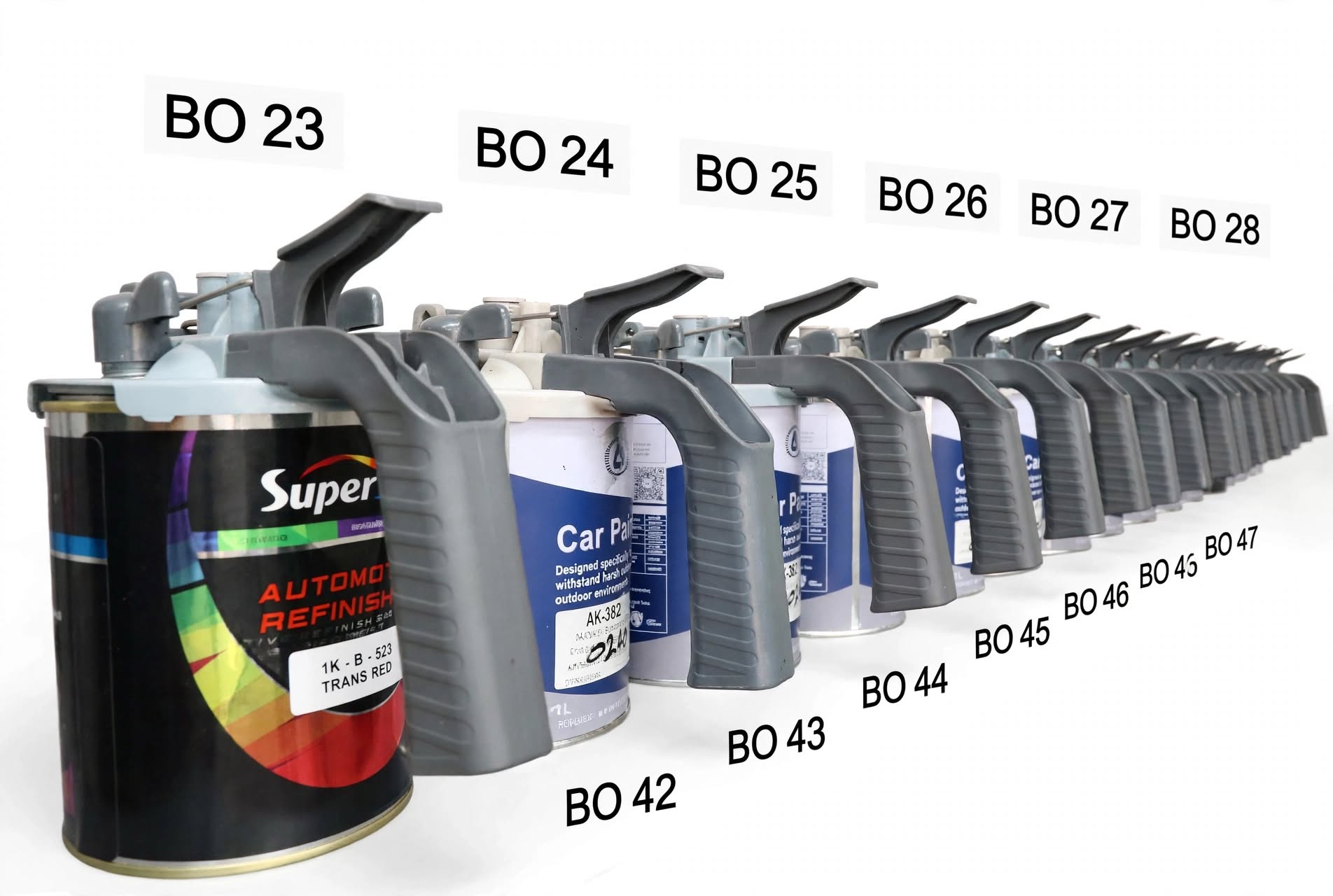 Row of mixed automotive paint tins